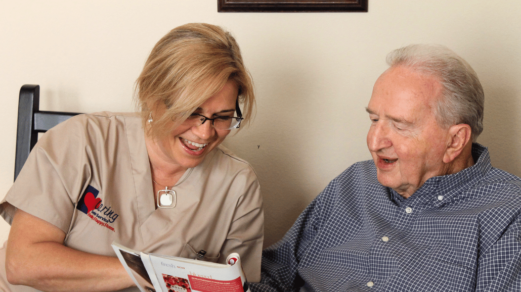 Blog Covers – 2025-02-13T111032.925 Caring Senior Service caregiver reading a magazine with senior man