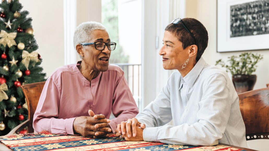 Blog Covers – 2024-10-31T085534.293 Senior mother with adult daughter talking at kitchen table