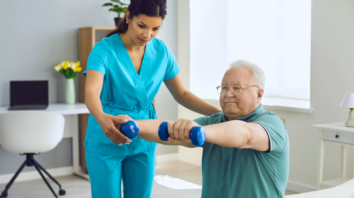 In-home therapist working with a senior to do exercises