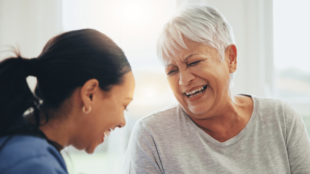 Blog Covers – 2025-01-09T090736.419 Senior woman laughing with her caregiver