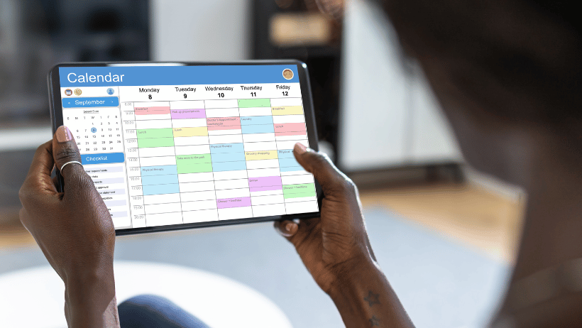 Family caregiver holding up a calendar