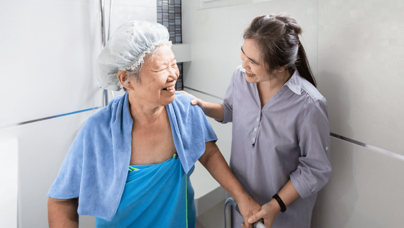 Blog20Covers20-202023-03-21T141145.921 Caregiver assisting an elderly woman taking a shower