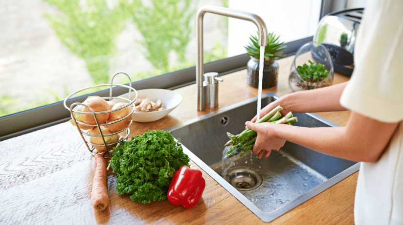 Blog20Covers20-202023-08-25T074544.283 Woman washing fresh vegetables at the kitchen sink