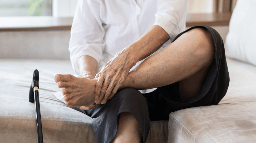 Blog20Covers20-202023-10-31T153100.318 Elderly person sitting on a bed rubbing their feet