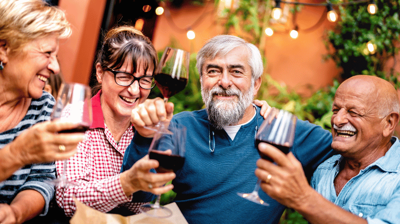 Blog20Covers20-202023-12-08T112741.795 Group of senior adults drinking wine at an outdoor restaurant