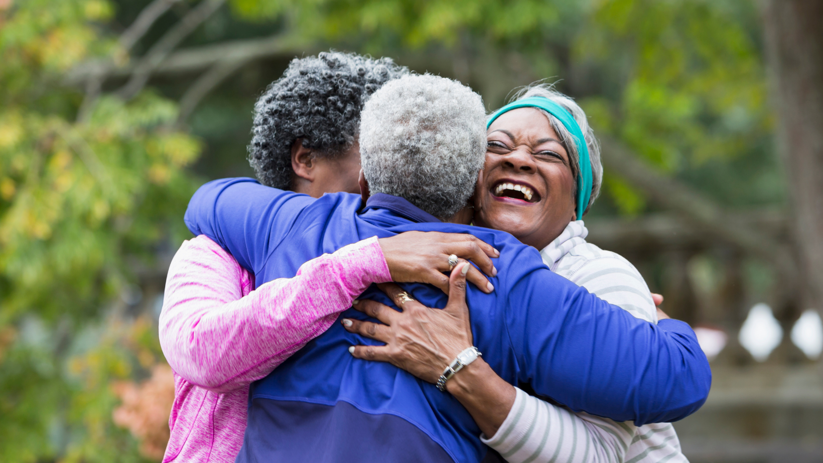 Blog20Covers2028329 Group of senior Black women hugging after a jog