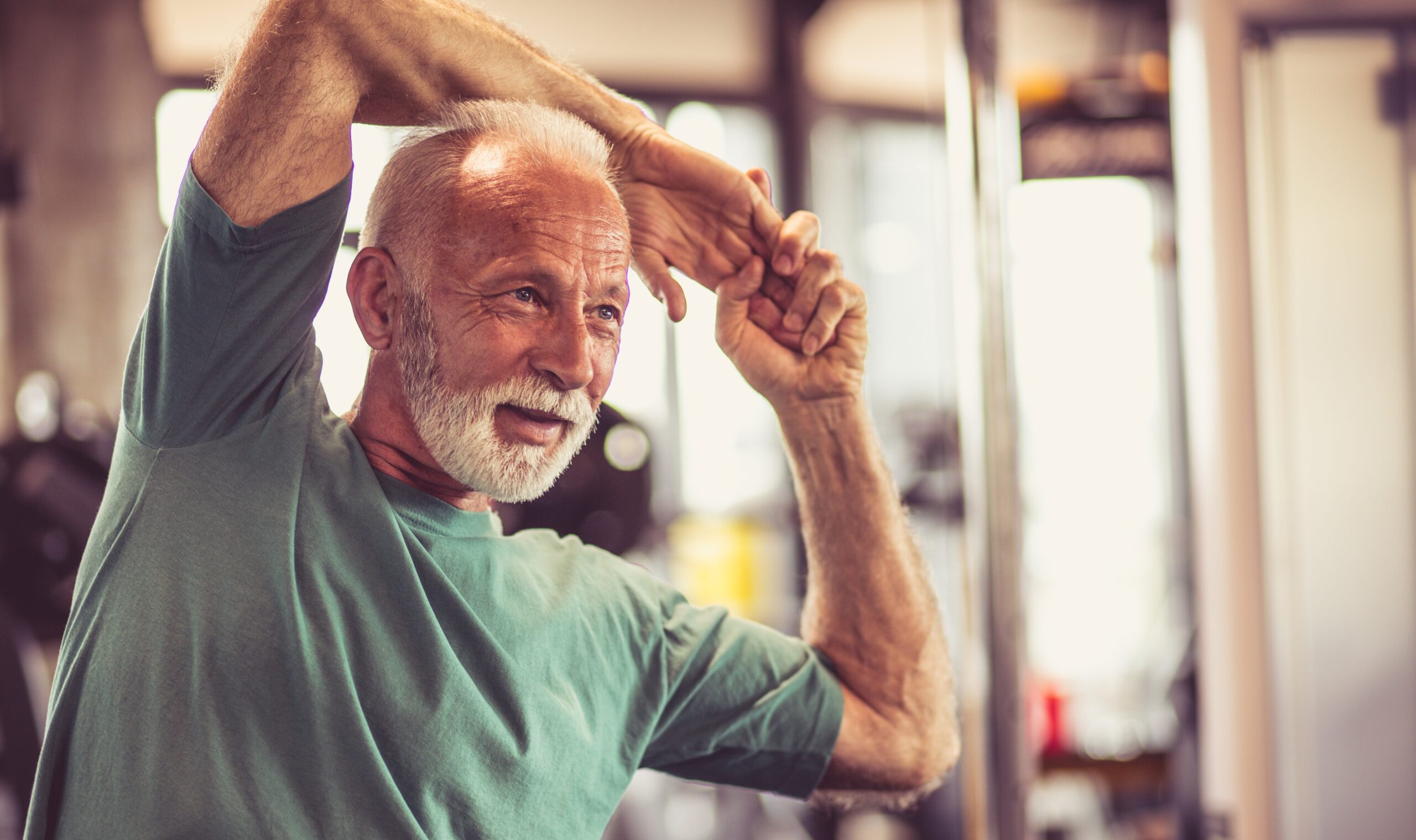 E4087447-96E0-47BD-893B-F94ED14E5955 Senior man stretching his arms