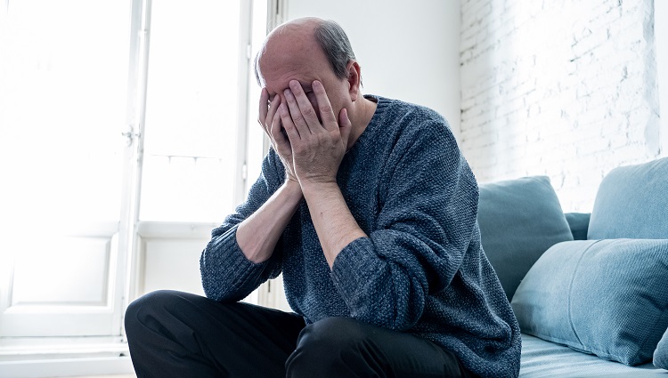 Depressed Overwhelmed Old Man Feeling Exhausted Alone And Unhapp Portrait of older adult senior man in pain with sad and exhausted face in human emotions facial expression retirement and depression concept isolated on neutral background.