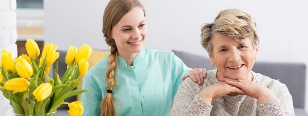 assisted_living_caregiver_senior-LR Caregiver smiling at a female caregiver
