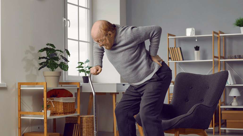 Senior man grabbing his back in pain