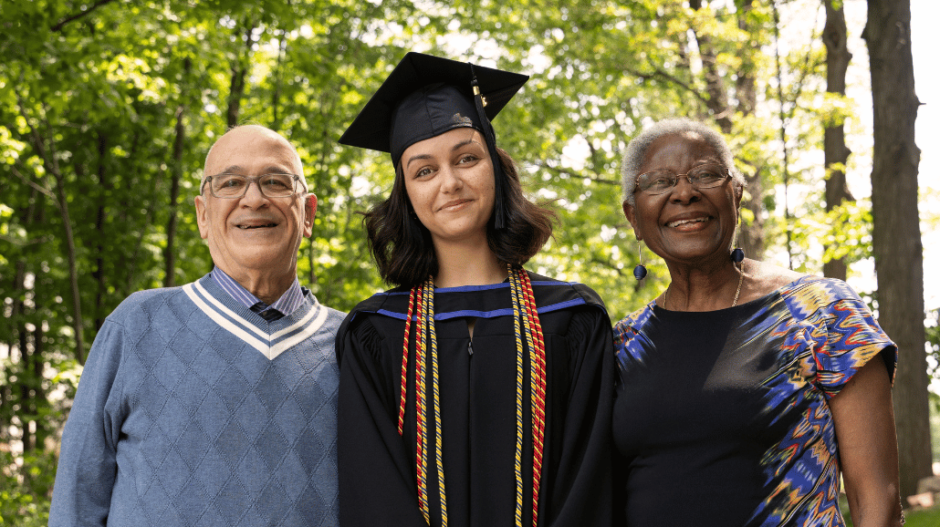 Grandparents with their granddaughter at graduation