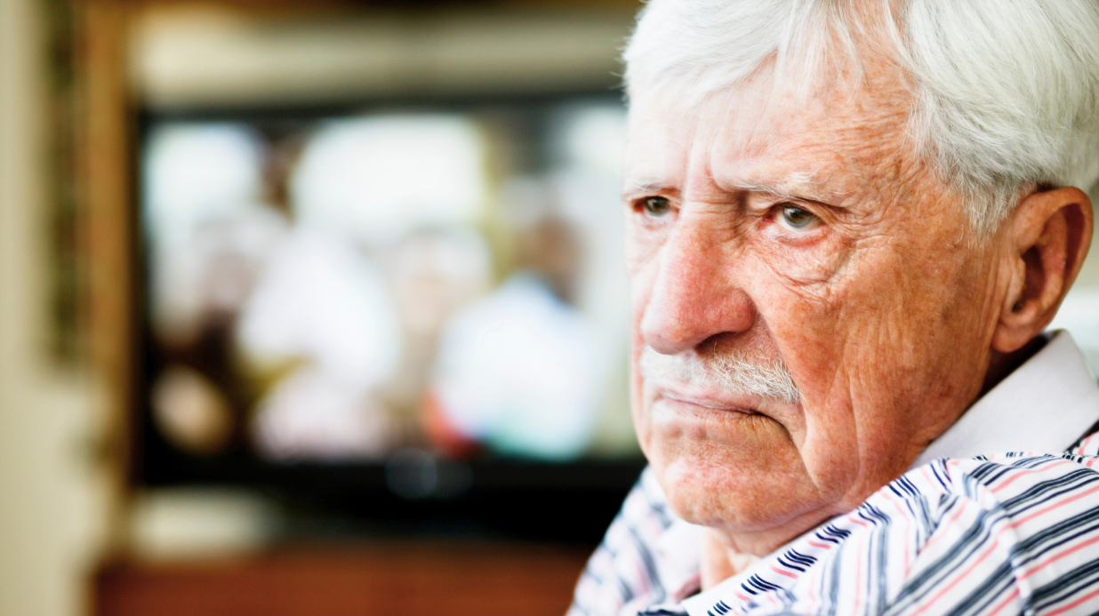 Grumpy old man looking off into space