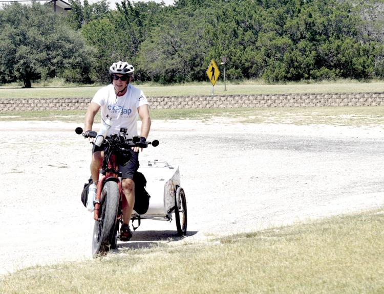 610977bd0b8db.image_ Jeff Salter riding ebike for Close the Gap in Senior Care