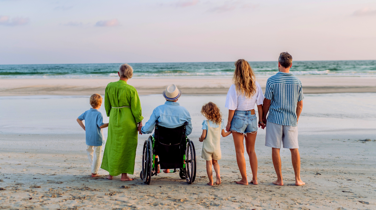 Multi-generational family taking pictures at the beach