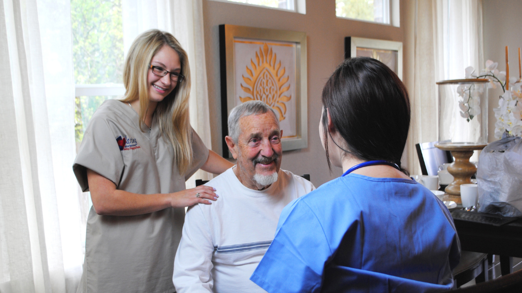 Caring Senior Service caregiver helping a senior