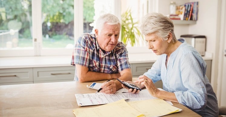 Senior20couple20reviewing20finances Senior couple reviewing financial documents together