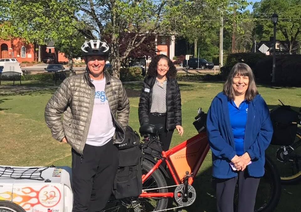 Caring Senior Service CEO Bikes through Woodstock Raising Money for Senior Needs