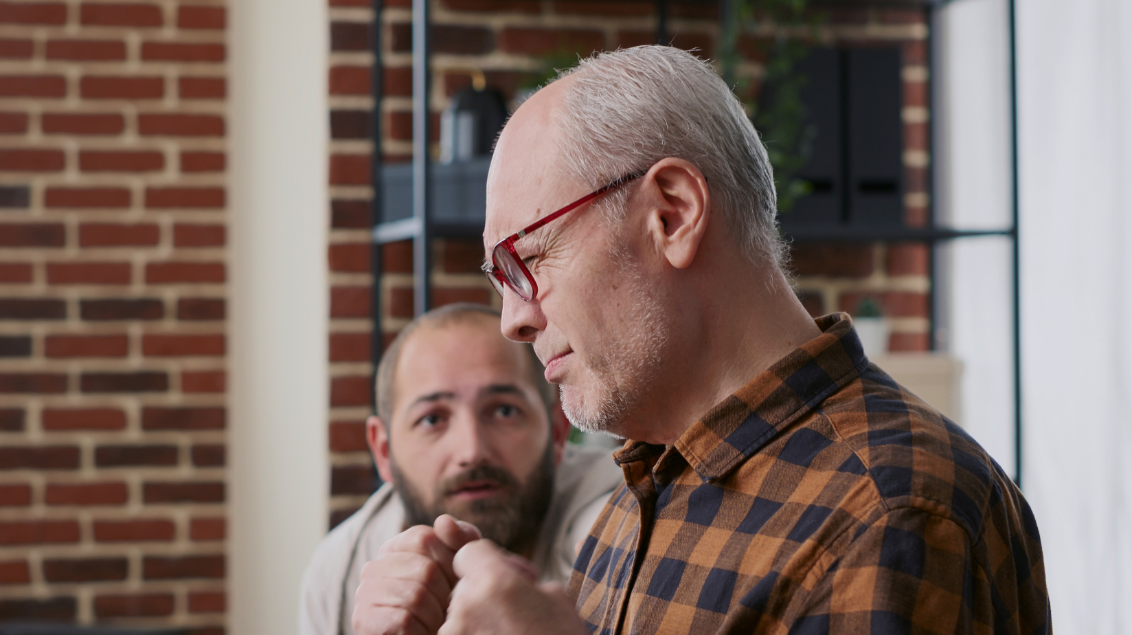 Autistic senior at home with male caregiver