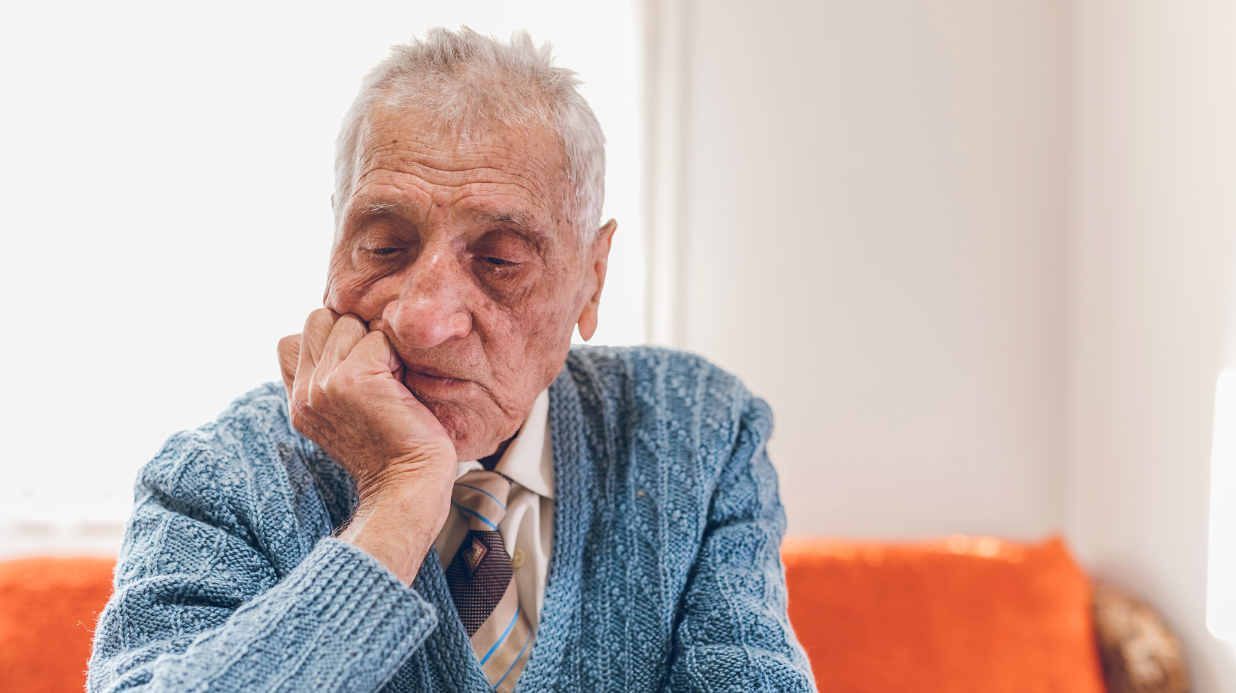 Isolated senior sitting on a couch
