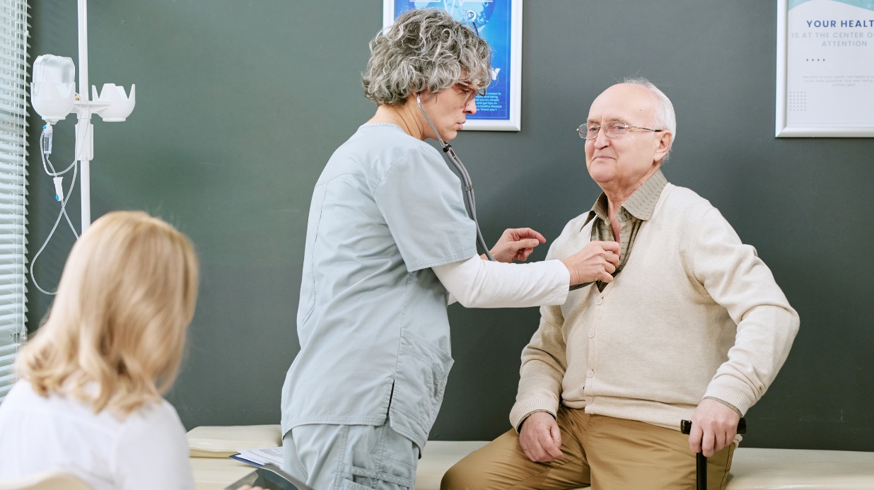 Blog Covers – 2026-10-08T150042.073 Doctor in an exam room, listening to the heart of a senior patient